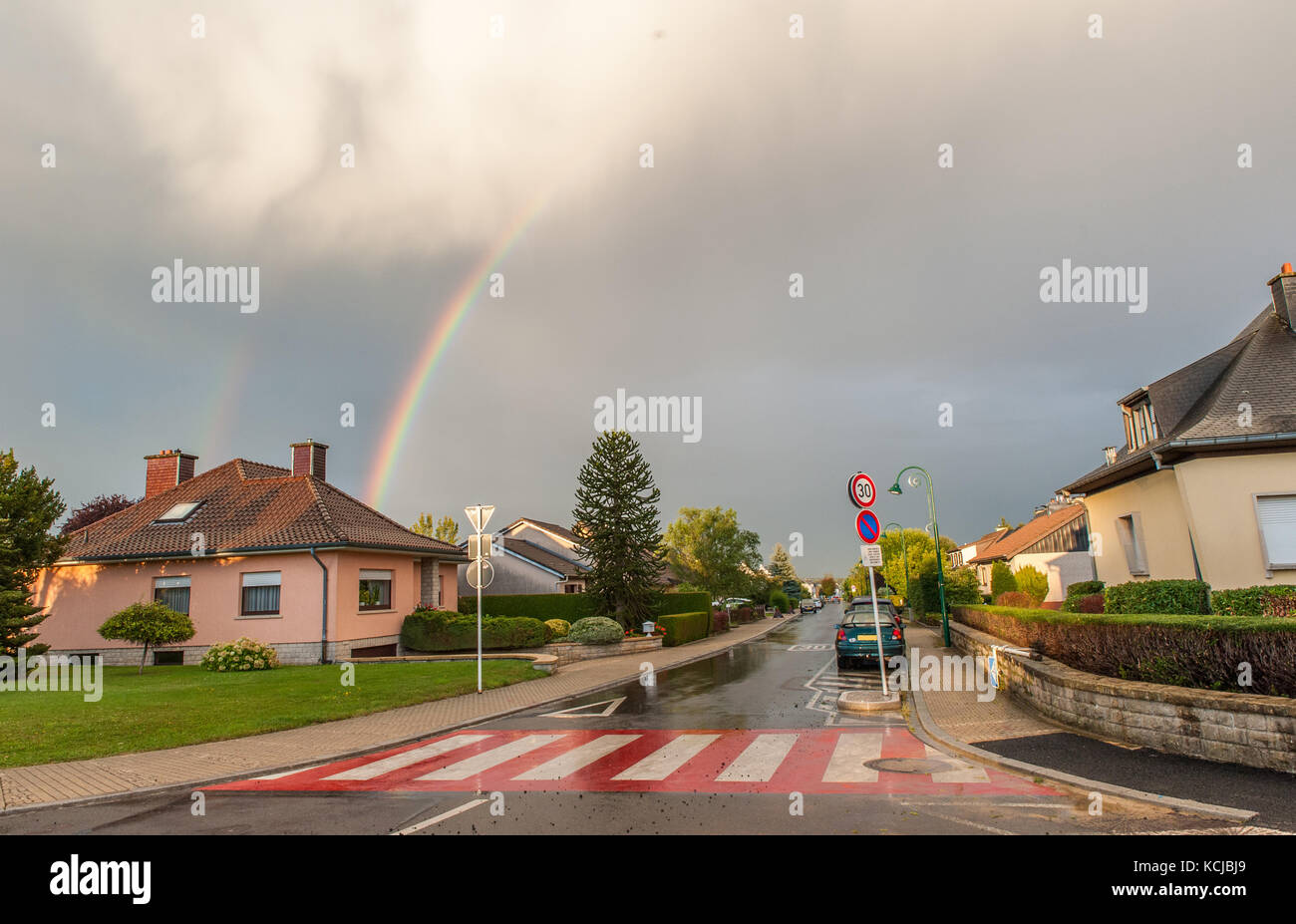 Rainbow over the houses, Luxembourg Stock Photo