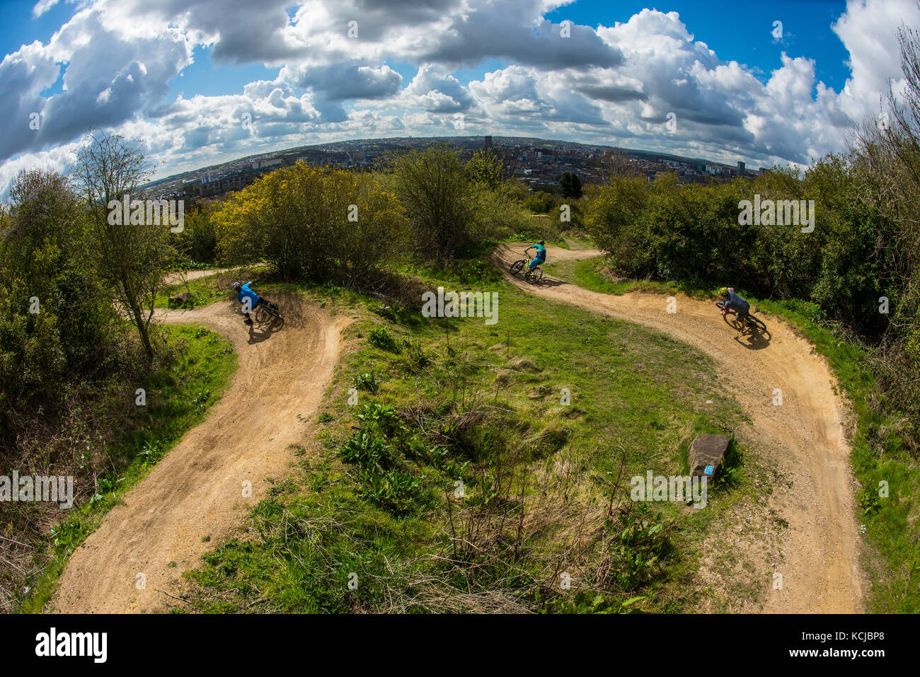Three mountain bikers ride the trails at Parkwood Springs in Sheffield city centre. Stock Photo