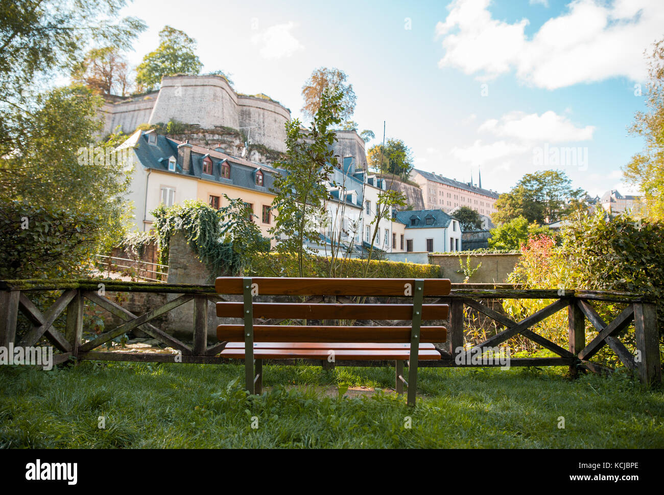 Empty bench in a public park near the river of Luxembourg, Luxembourg Stock Photo