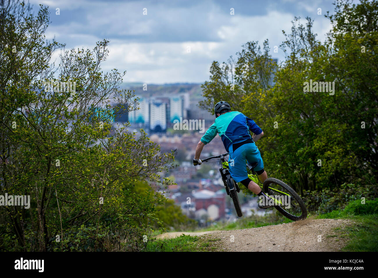A mountain biker rides the trails at Parkwood Springs in Sheffield city centre. Stock Photo