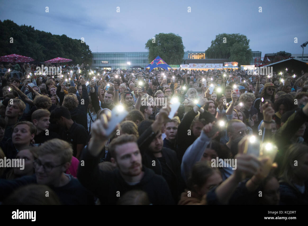 Denmark, Copenhagen – August 26, 2017. Concert goers put their smart