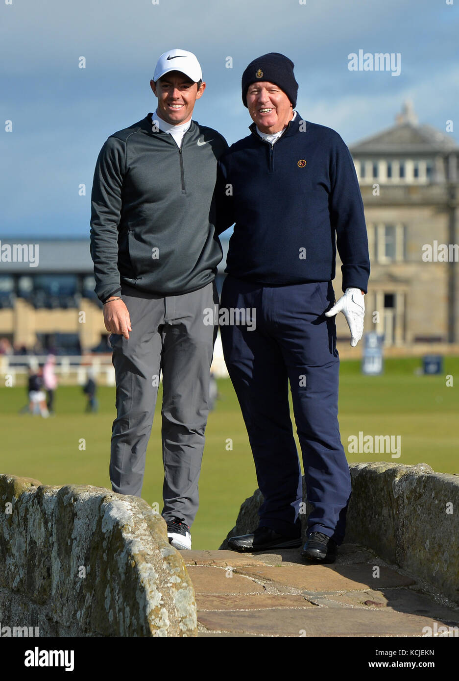 Rory McIlroy and Jerry McIlroy on the Swilken Bridge during day one of the Alfred Dunhill Links Championship at St Andrews. Stock Photo