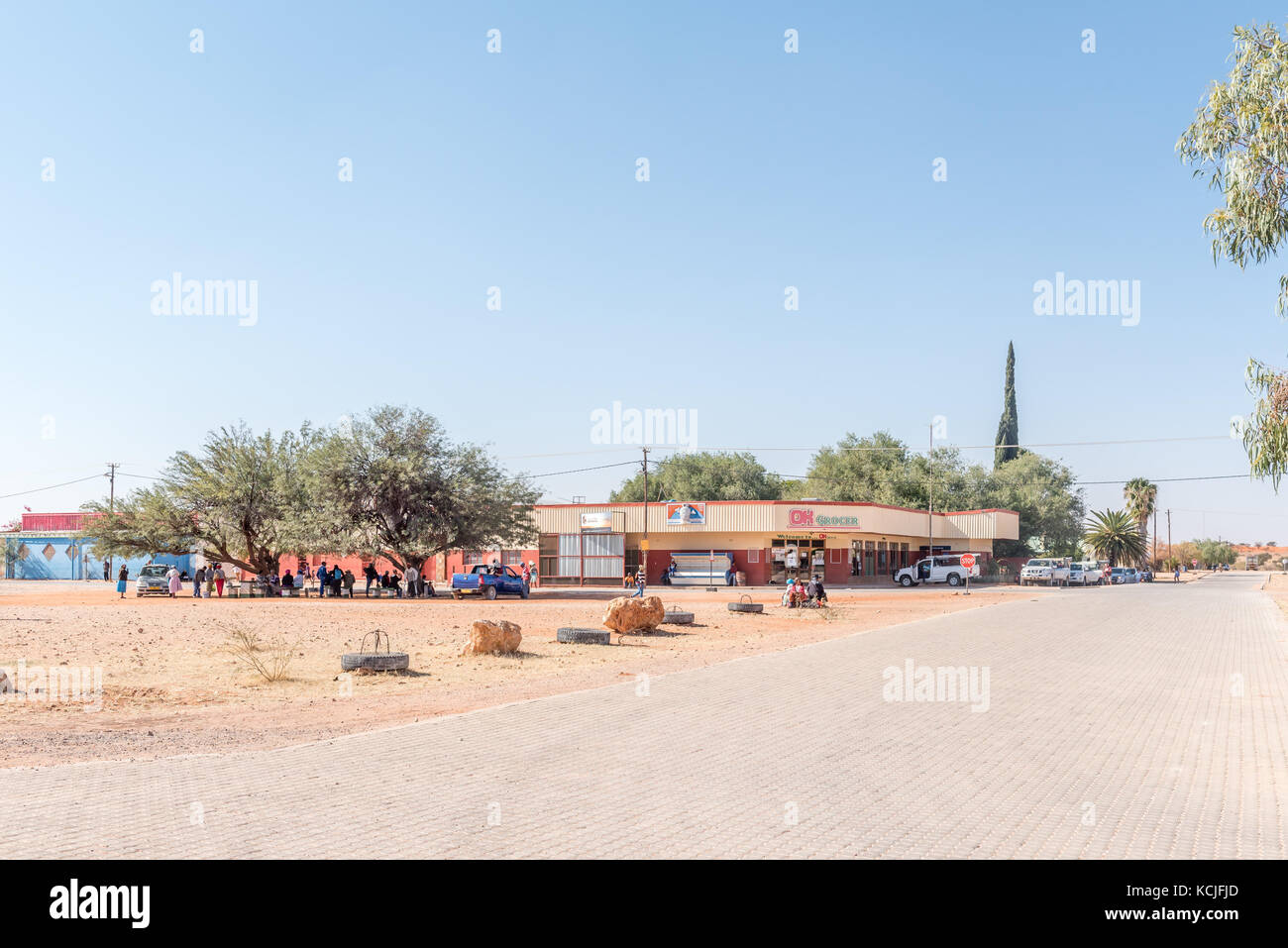 GOCHAS, NAMIBIA - JULY 5, 2017: A street scene with a supermarket, vehicles and people in Gochas in the Hardap Region in Namibia Stock Photo