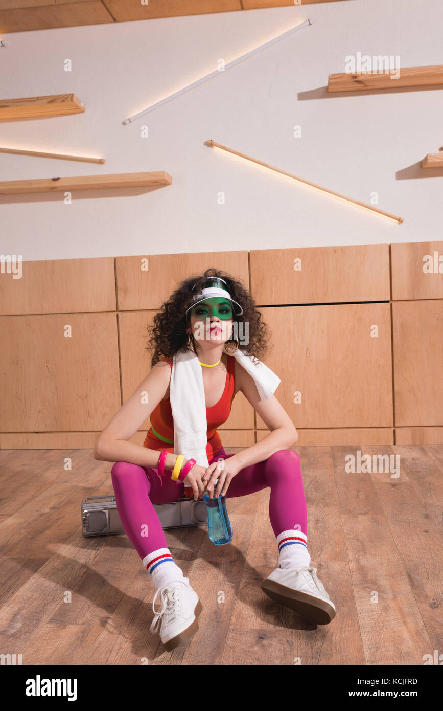 fashionable woman sitting on boombox Stock Photo - Alamy