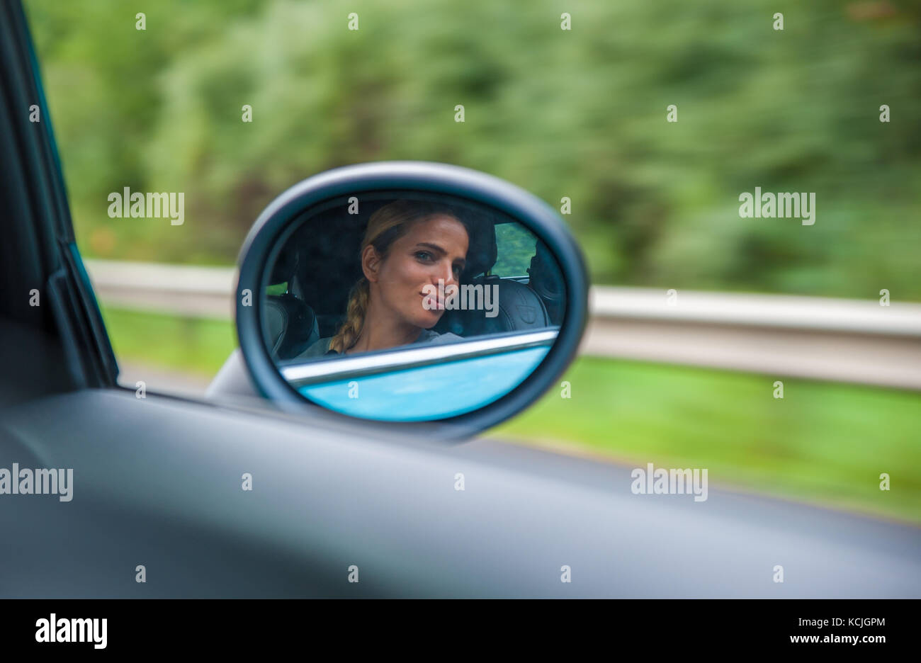 Portrait In Rear View Mirror Person smiling into a mirror hi-res stock photography and images - Alamy