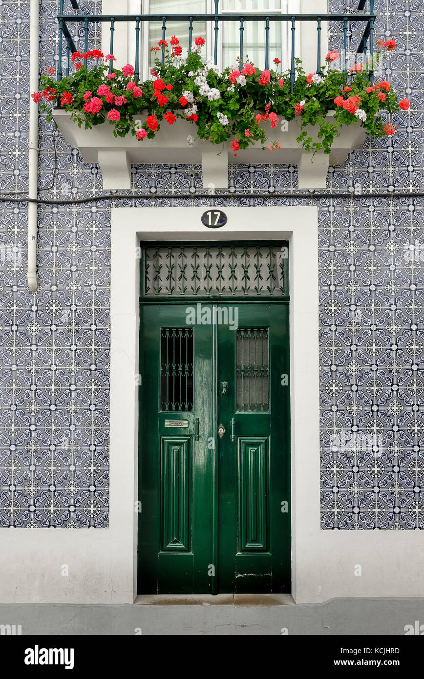 Typical Portuguese architecture style residence in the city center of Aveiro, with walls covered of ceramic tiles in rich floral graphic design Stock Photo