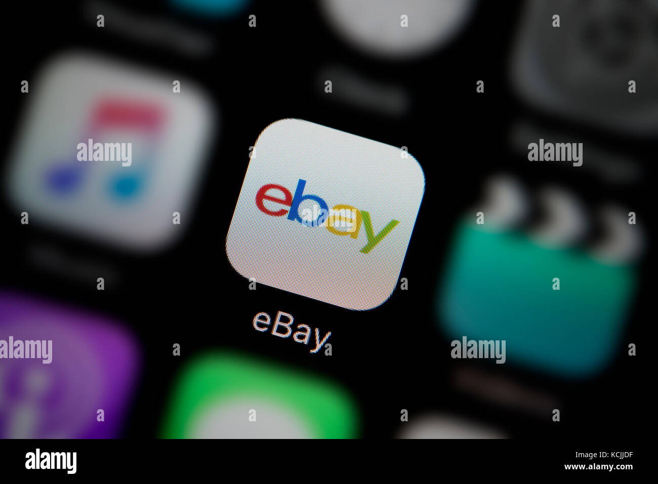 A close-up shot of the company logo representing the ebay app icon, as seen on the screen of a smart phone (Editorial use only) Stock Photo