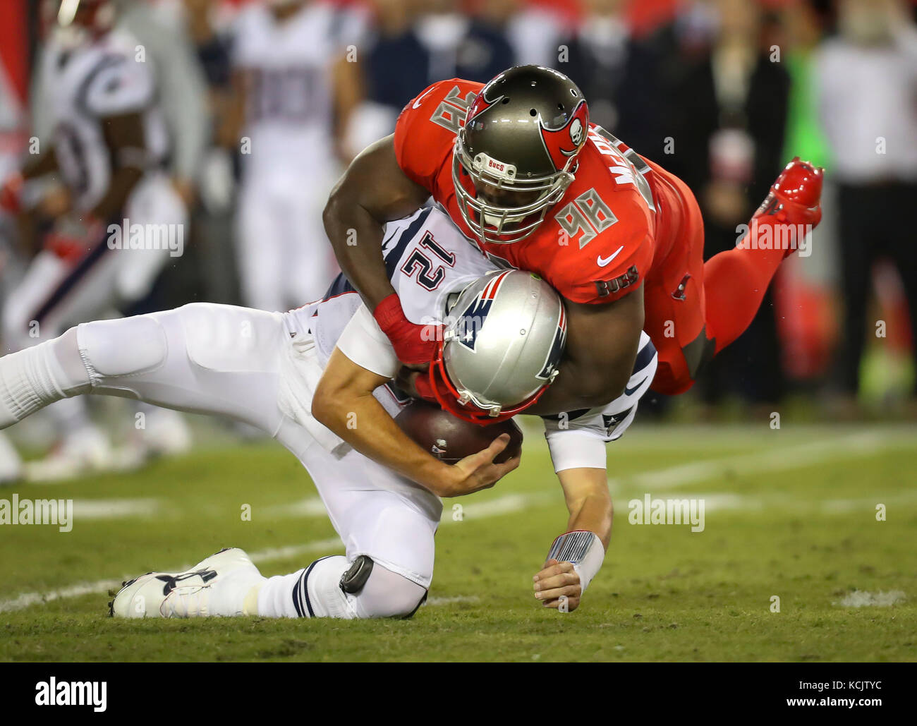 Tampa, Florida, USA. 5th Oct, 2017. MONICA HERNDON | Times.New England Patriots quarterback Tom Brady (12) wrapped up by Tampa Bay Buccaneers defensive tackle Clinton McDonald (98) in the first quarter of the Tampa Bay Buccaneers game against the New England Patriots on October 5, 2017 at Raymond James Stadium in Tampa, Fla. Credit: Monica Herndon/Tampa Bay Times/ZUMA Wire/Alamy Live News Stock Photo
