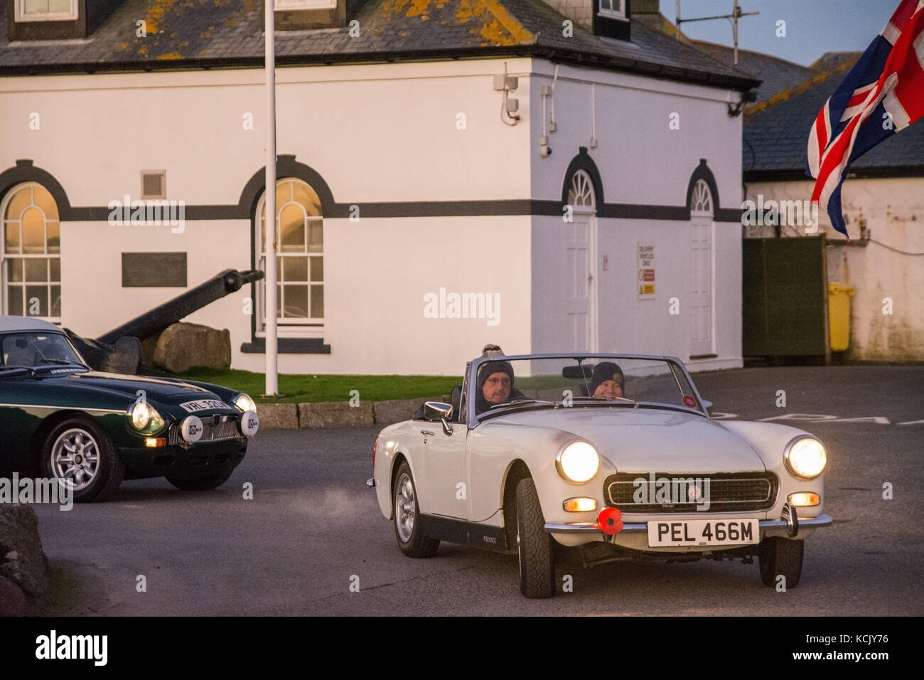 Lands end, Cornwall, UK. 6th October, 2017. MG drivers head off from a chilly Lands End at sunrise for the Royal British Legion charity drive to John O'Groats. The first stop is Lake Windermere. Credit: Simon Maycock/Alamy Live News Stock Photo