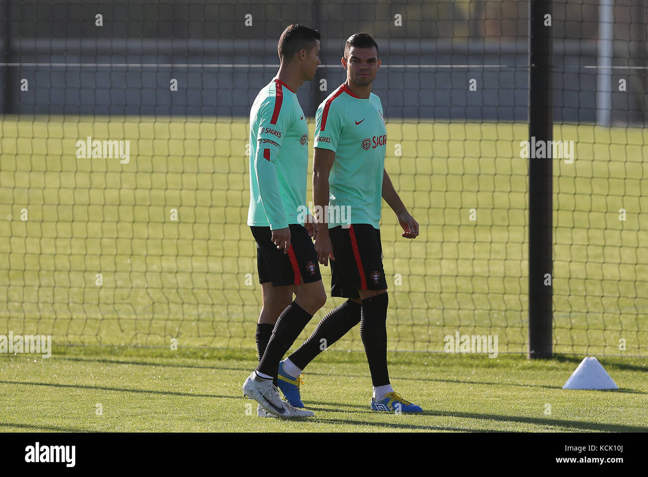 Oeiras, Portugal. 05th Oct, 2017. Portugal defender Pepe talks with Portugal forward Cristiano Ronaldo during National Team Training session before the match between Portugal and Andorra at City Football in Oeiras, Lisbon on October 5, 2017. ( Credit: Bruno Barros/Alamy Live News Stock Photo