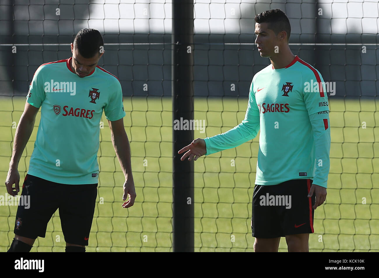 Oeiras, Portugal. 05th Oct, 2017. Portugal defender Pepe (L) talks with Portugal forward Cristiano Ronaldo (R) during National Team Training session before the match between Portugal and Andorra at City Football in Oeiras, Lisbon on October 5, 2017. ( Credit: Bruno Barros/Alamy Live News Stock Photo