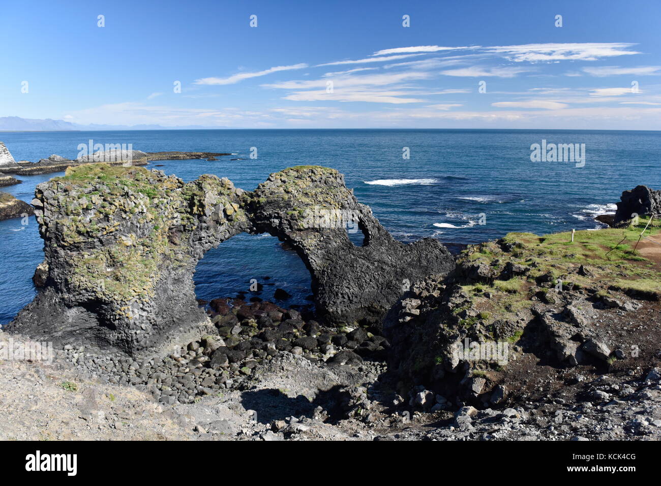 Shoreline and cliffs of basalt rock at Arnarstapi nature reserve seen ...