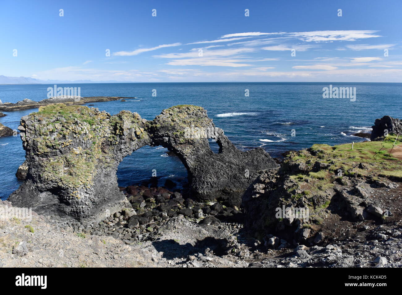 Shoreline and cliffs of basalt rock at Arnarstapi nature reserve seen ...