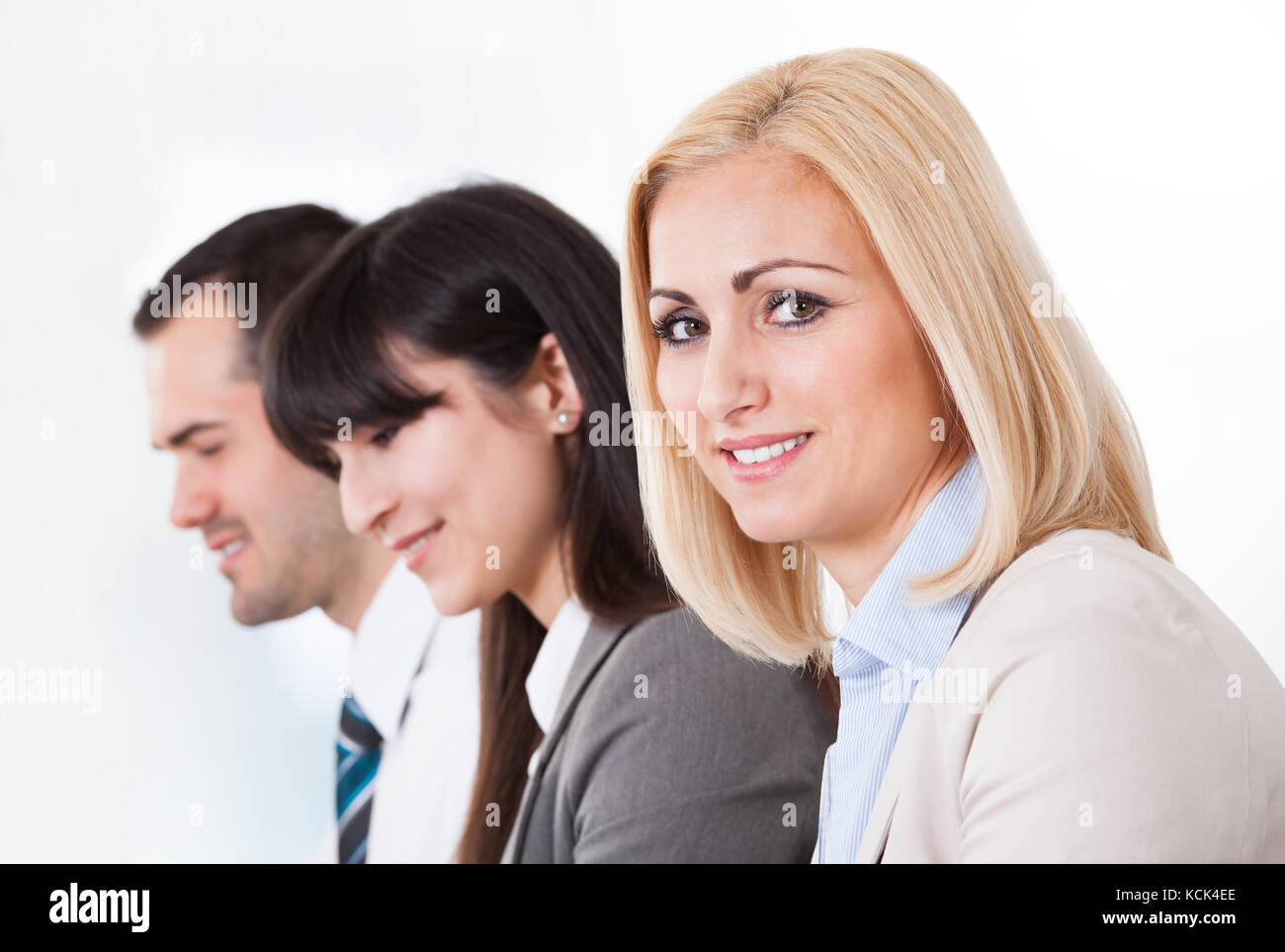 Close Up Of Happy Business People In A Row Stock Photo - Alamy