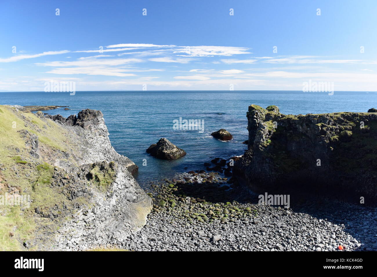 Shoreline and cliffs of basalt rock at Arnarstapi nature reserve seen ...