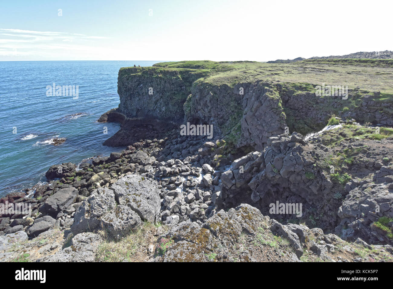 Shoreline and cliffs of basalt rock at Arnarstapi nature reserve seen ...