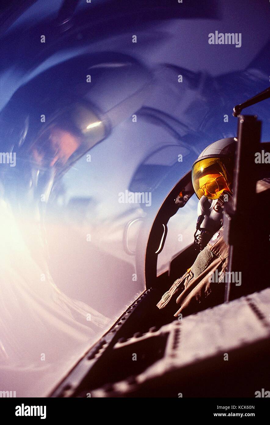 A U.S. Air Force pilot scans the horizon from the cockpit of a F-15D Eagle tactical fighter aircraft while on a combat patrol near the Iraqi border during Operation Desert Shield February 24, 1992 in Saudi Arabia.  (photo by Don Sutherland  via Planetpix) Stock Photo
