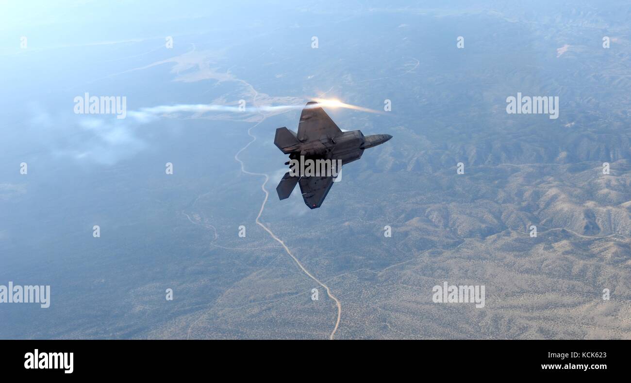 A U.S. Air Force F-22 Raptor stealth tactical fighter aircraft flies over the Nellis Air Force Base Nevada Test and Training Range July 10, 2017 near Las Vegas, Nevada.  (photo by Daryn Murphy via Planetpix) Stock Photo