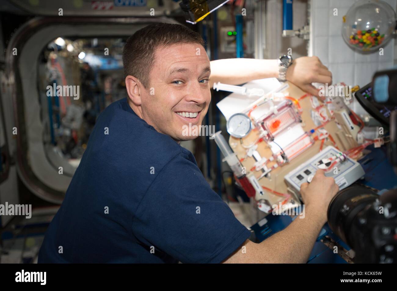 NASA International Space Station Expedition 51 prime crew member American astronaut Jack Fischer works on the Capillary Structures for Exploration Life Support experiment July 10, 2017 in Earth orbit.  (photo by NASA Photo  via Planetpix) Stock Photo