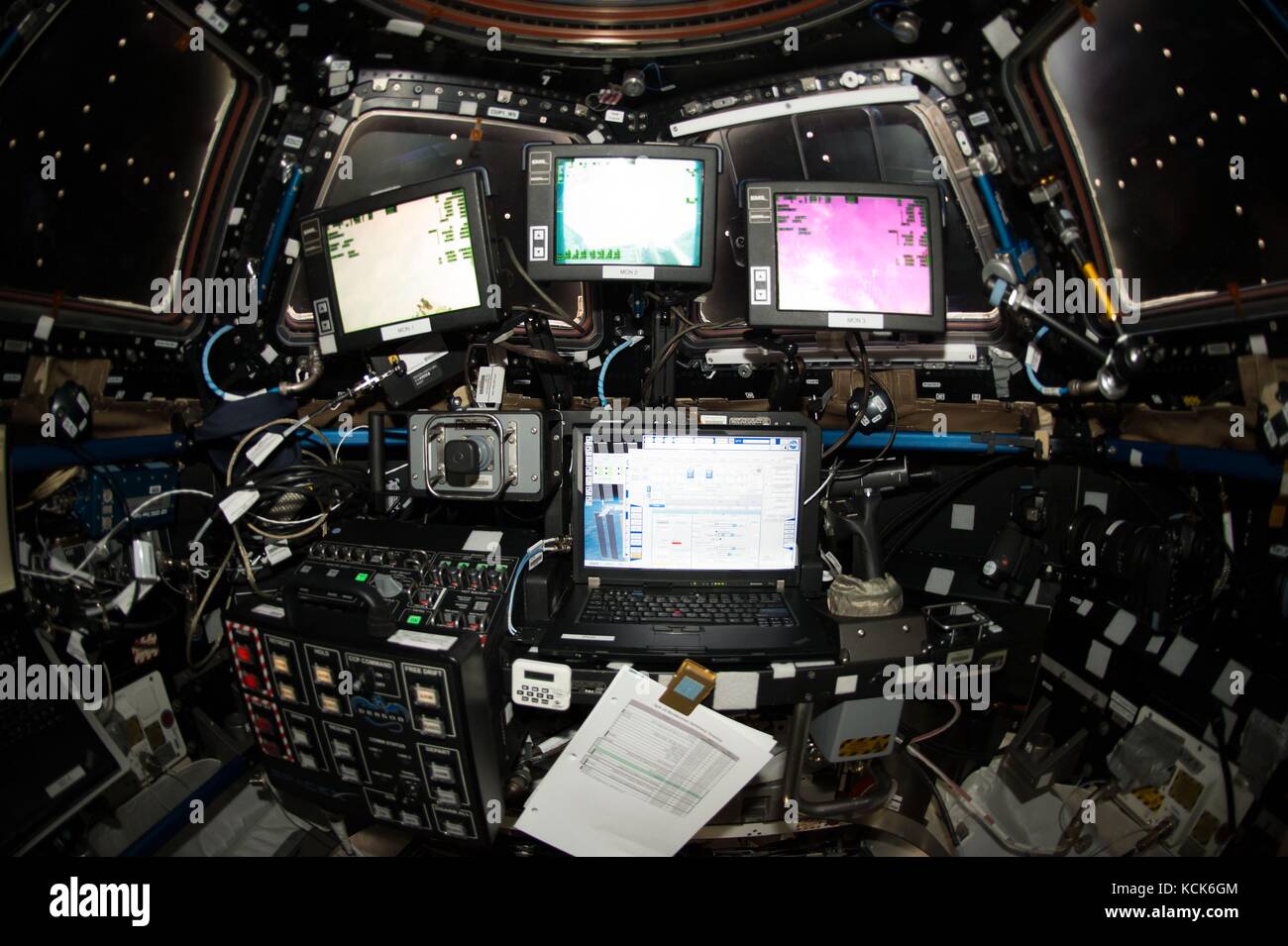Computer monitors inside the NASA International Space Station Cupola module robotics workstation prepare to capture the SpaceX Dragon cargo spacecraft with the Canadarm2 robotic arm February 23, 2017 in Earth orbit.  (photo by NASA Photo  via Planetpix) Stock Photo