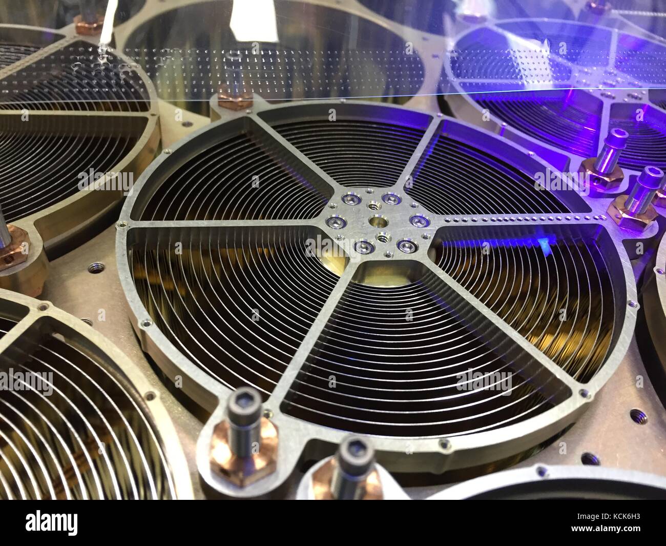 The NASA Neutron Star Interior Composition Explorer (NICER) x-ray concentrator optics are inspected under a black light for dust or foreign objects that could impair functionality once in space at the Goddard Space Flight Center July 6, 2015 in Greenbelt, Maryland. NICER will launch aboard the SpaceX CRS-11 commercial resupply spacecraft and will be the first mission to study neutron stars.  (photo by Keith Gendreau  via Planetpix) Stock Photo
