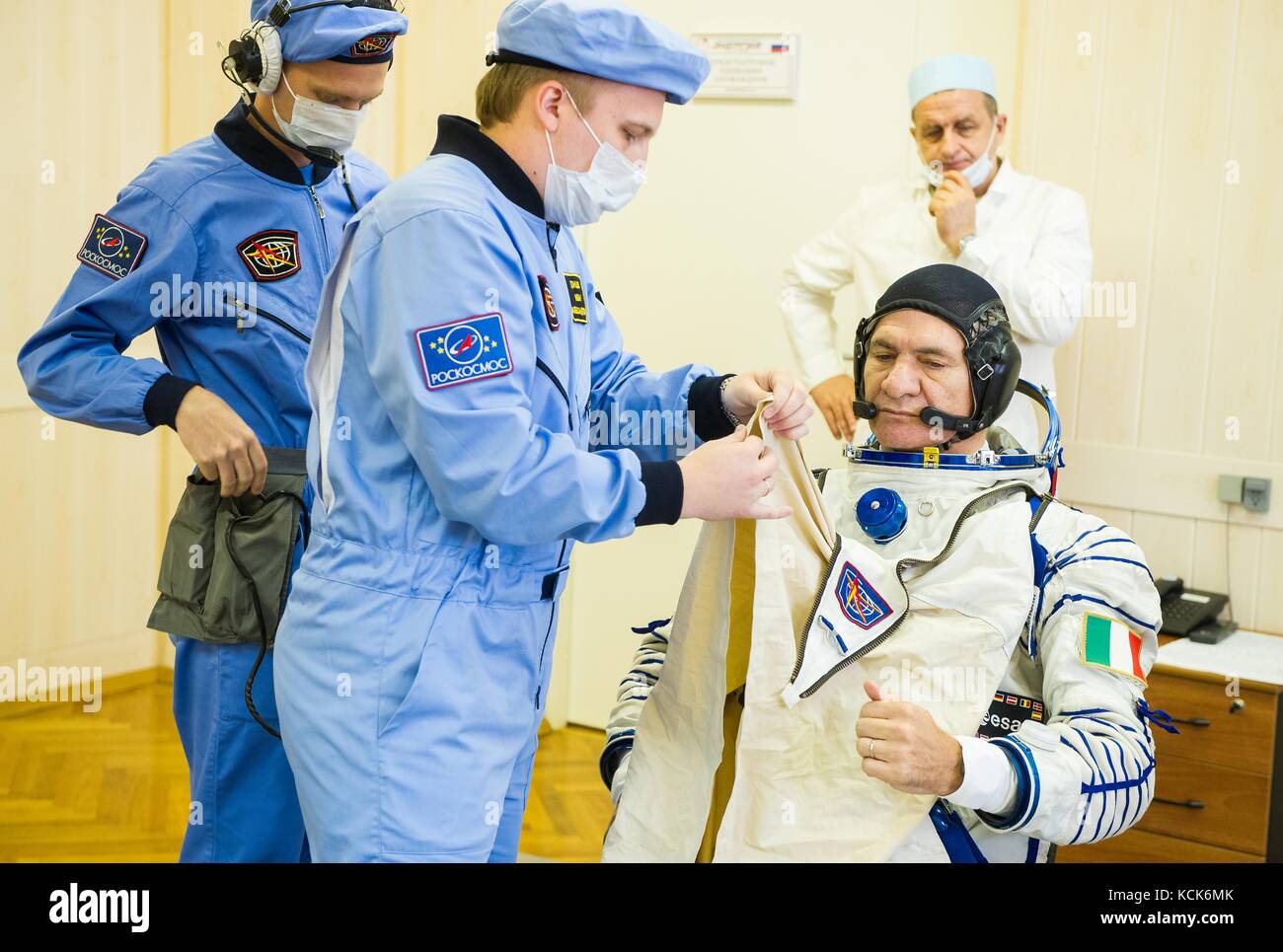 NASA International Space Station Expedition 52 prime crew member Italian astronaut Paolo Nespoli of the European Space Agency is helped into his Sokol spacesuit in preparation for the Soyuz MS-05 launch at the Baikonur Cosmodrome July 28, 2017 in Baikonur, Kazakhstan.  (photo by Andrey Shelepin  via Planetpix) Stock Photo