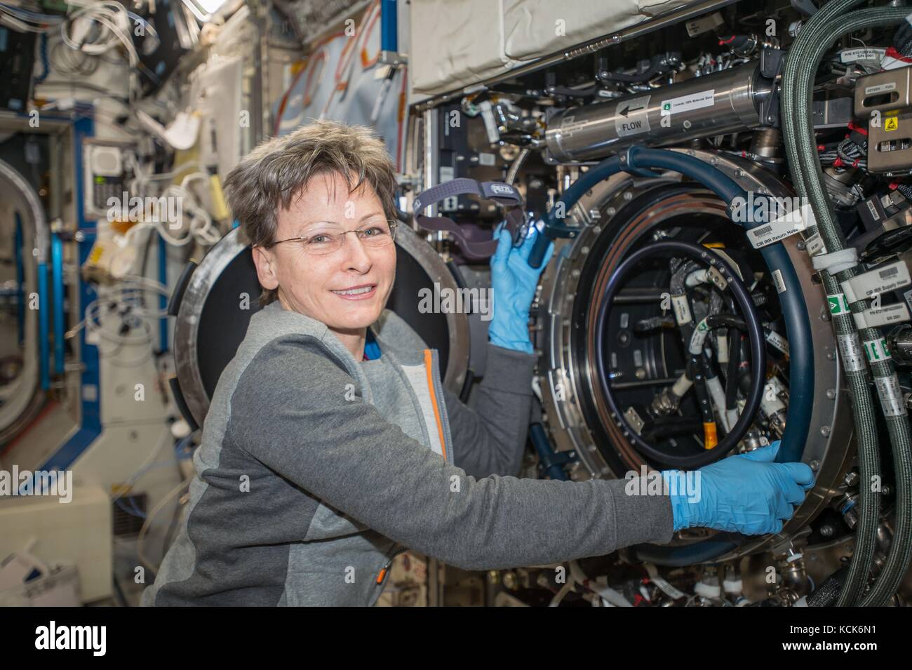 NASA International Space Station Expedition 51 prime crew member American astronaut Peggy Whitson works on an experiment in the U.S. Destiny Laboratory Module August 4, 2017 in Earth orbit.  (photo by NASA Photo  via Planetpix) Stock Photo