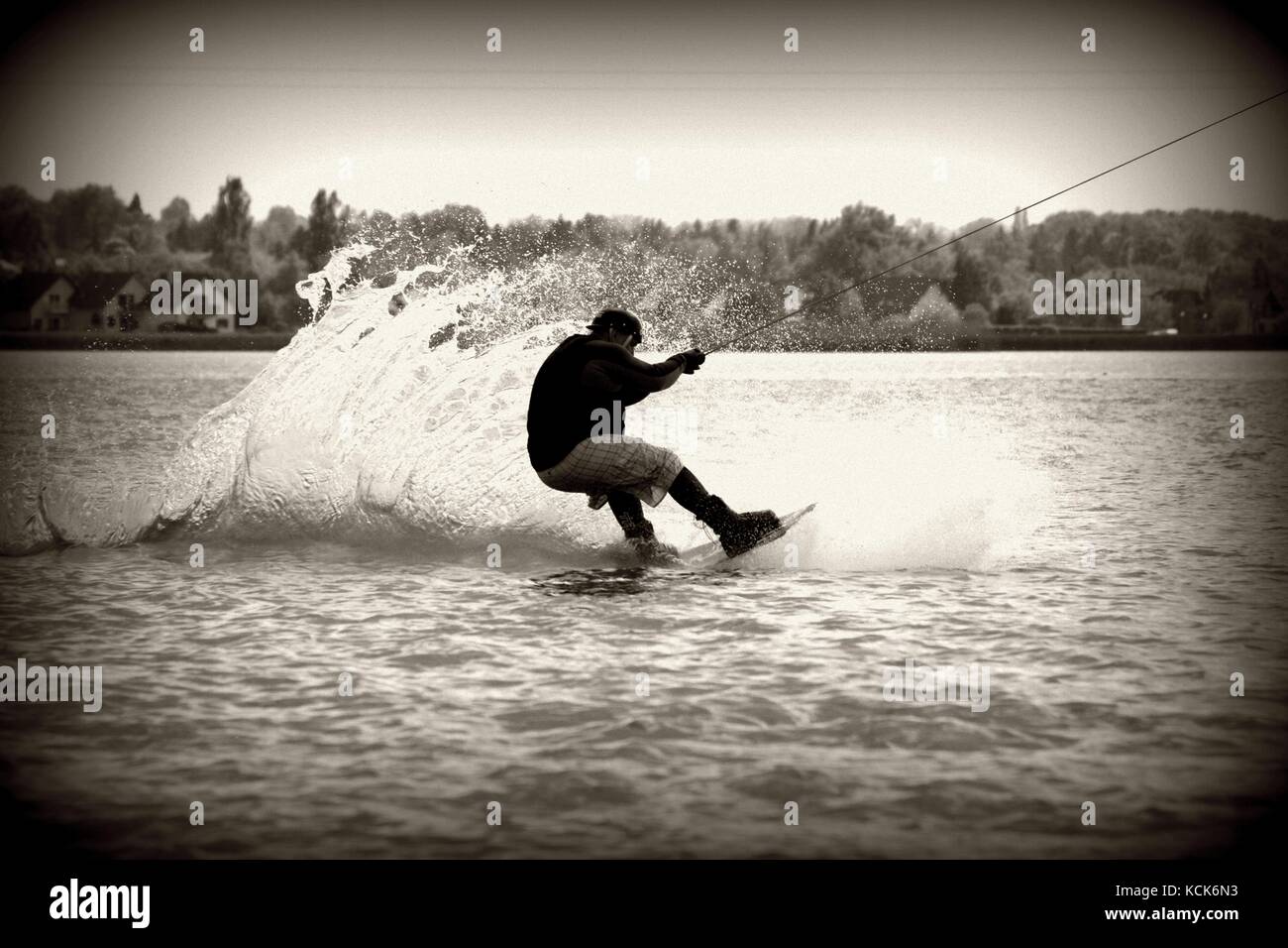 Summer wakeboard. Wakeboardig on the water. Big water waves Stock Photo