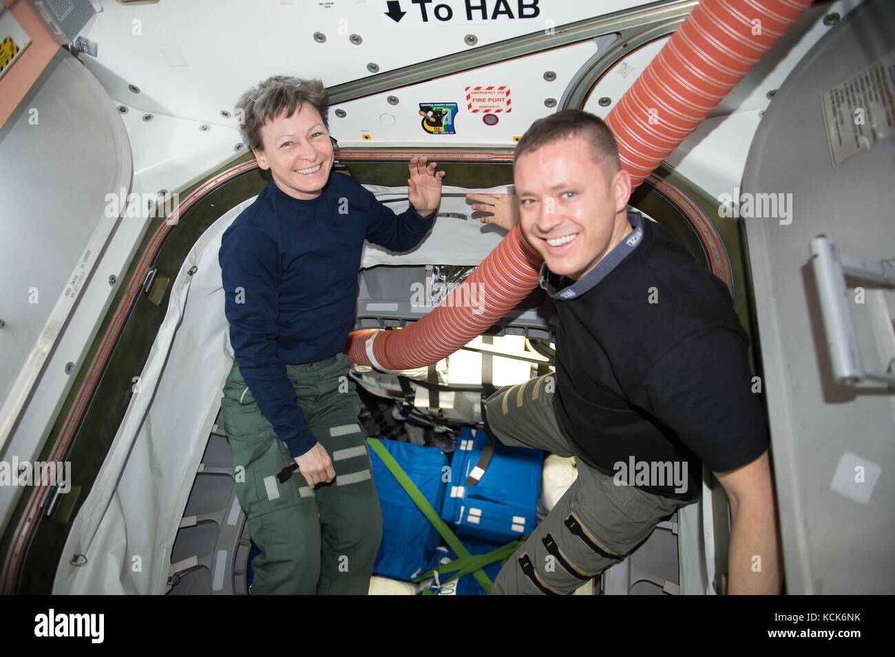 NASA International Space Station Expedition 51 prime crew members American astronauts Peggy Whitson (left) and Jack Fischer pack gear into a hatch June 3, 2017 in Earth orbit.  (photo by NASA Photo  via Planetpix) Stock Photo