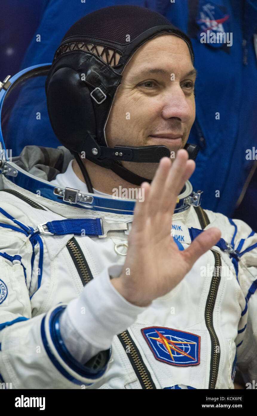 NASA International Space Station Expedition 52 prime crew member American astronaut Randy Bresnik waves as he waits to have his Sokol spacesuit pressure checked in preparation for the Soyuz MS-05 launch at the Baikonur Cosmodrome July 28, 2017 in Baikonur, Kazakhstan.  (photo by Joel Kowsky  via Planetpix) Stock Photo