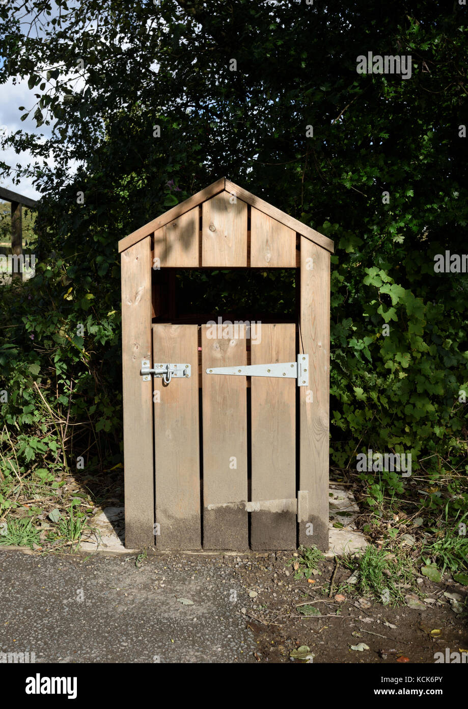 Wooden structure covering waste bin  in burrs country park bury lancashire uk Stock Photo