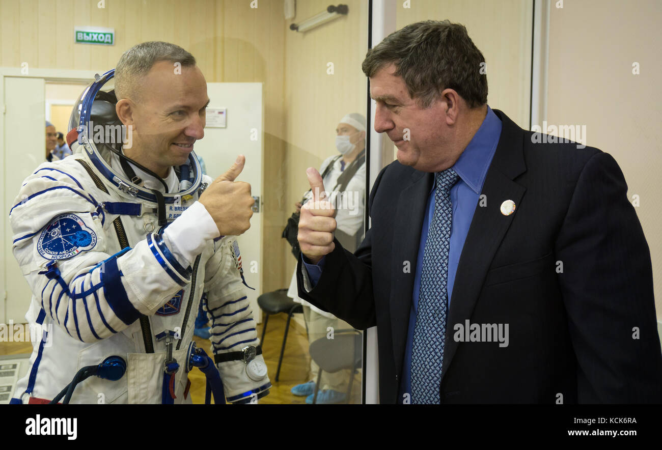 NASA International Space Station Expedition 52 prime crew member American astronaut Randy Bresnik (left) and NASA International Space Station Program Manager Kirk Shireman give each other a thumbs-up after the Sokol spacesuit pressure checks in preparation for the Soyuz MS-05 launch at the Baikonur Cosmodrome July 28, 2017 in Baikonur, Kazakhstan.  (photo by Victor Zelentsov  via Planetpix) Stock Photo