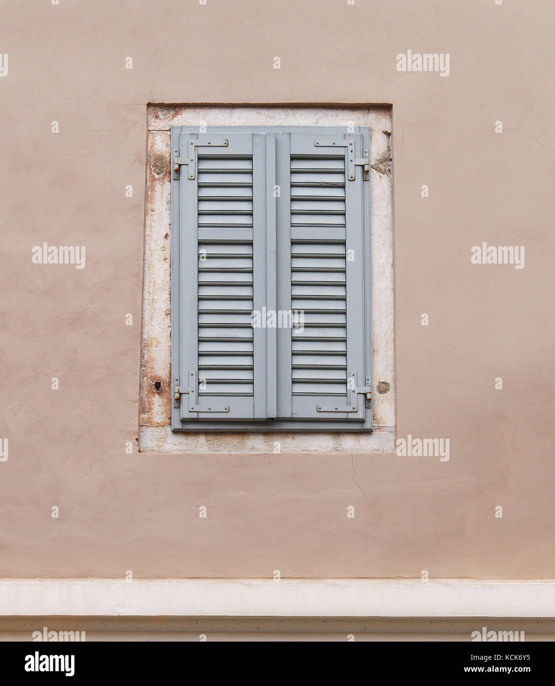 Closed retro wooden window on old house facade Stock Photo - Alamy