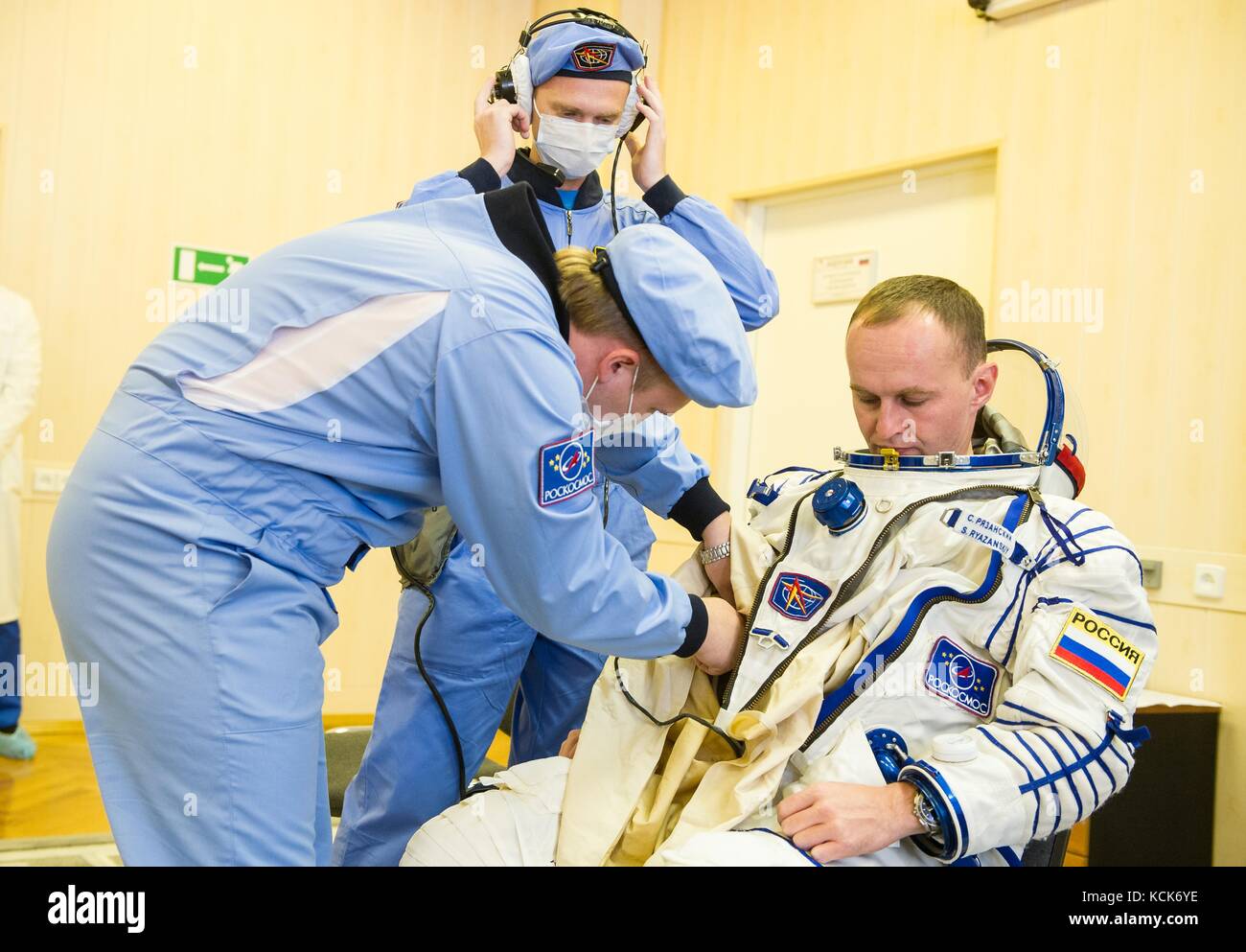 NASA International Space Station Expedition 52 prime crew member Russian cosmonaut Sergey Ryazanskiy of Roscosmos is helped into his Sokol spacesuit in preparation for the Soyuz MS-05 launch at the Baikonur Cosmodrome July 28, 2017 in Baikonur, Kazakhstan.  (photo by Andrey Shelepin  via Planetpix) Stock Photo