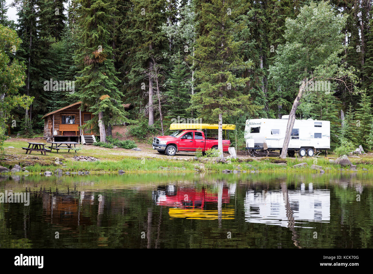 Canada, British Columbia, Chilcotin region, Nimpo Lake, RV camping, vacation, holiday, canoe, campsite, log cabin, Stock Photo