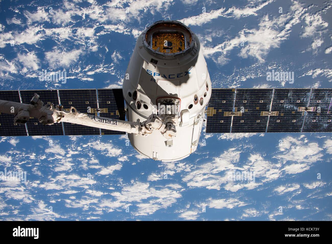 The NASA International Space Station Canadarm2 robotic arm captures the incoming SpaceX Dragon cargo spacecraft during a resupply mission June 5, 2017 in Earth orbit.  (photo by NASA Photo  via Planetpix) Stock Photo