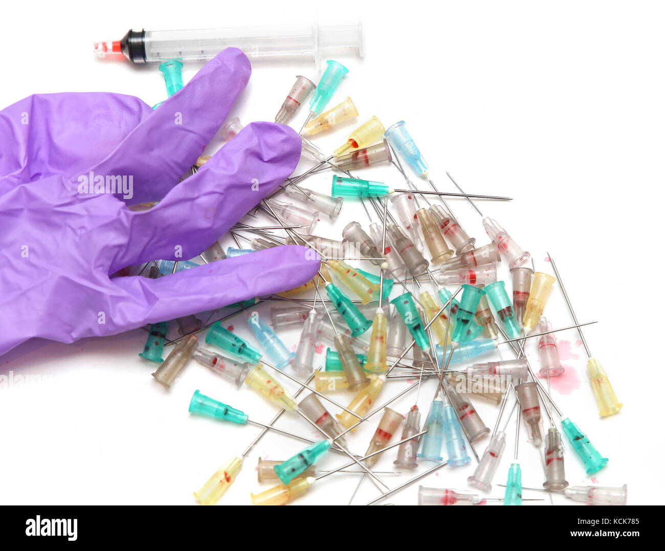 Used syringe needles with blood stains and surgical glove Stock Photo Alamy