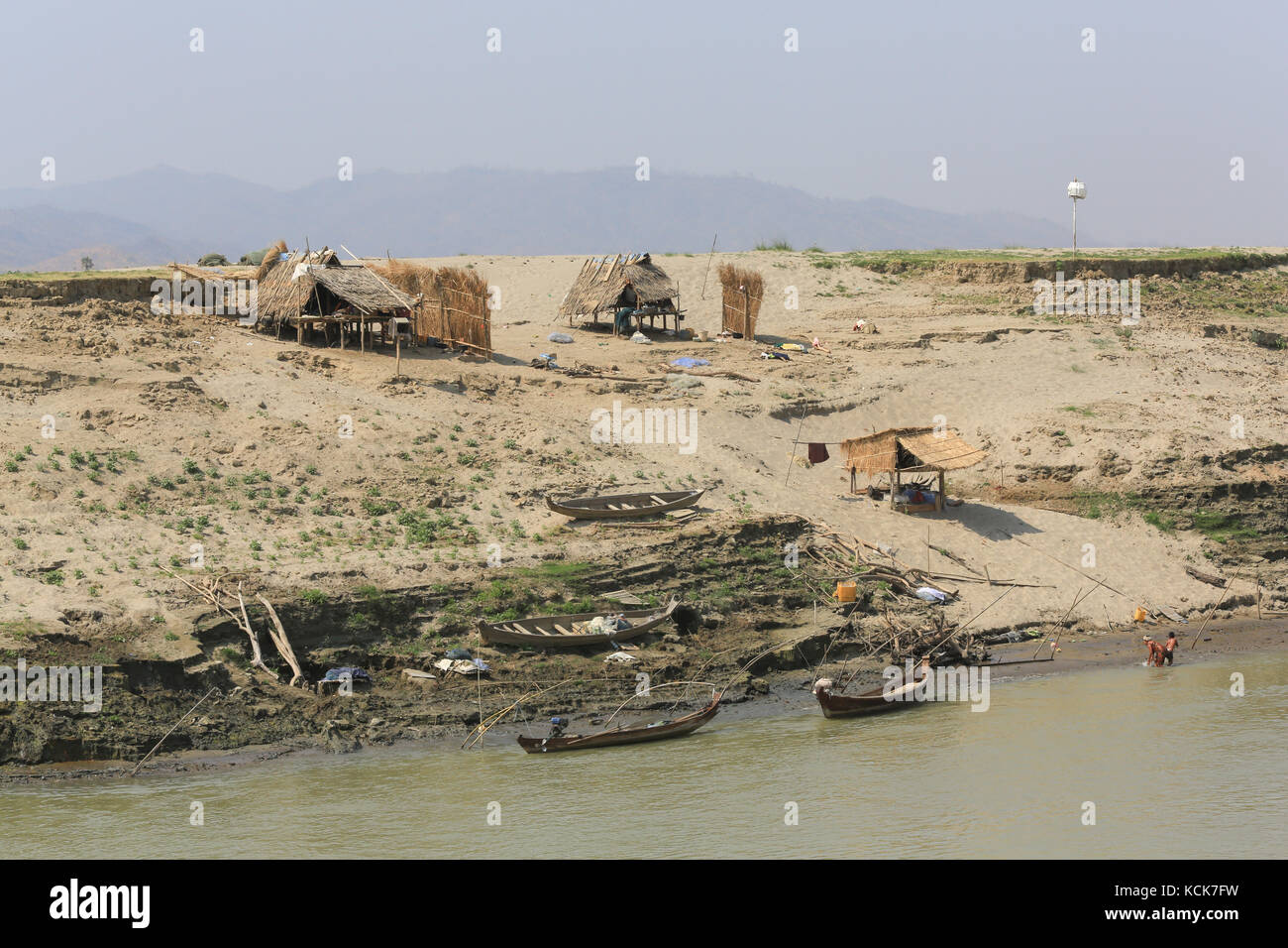 Seasonal huts and shelters along the banks of the Irrawaddy River in Myanmar (Burma). Stock Photo