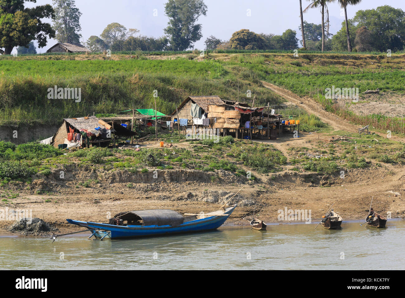 Seasonal huts and shelters along the banks of the Irrawaddy River in Myanmar (Burma). Stock Photo