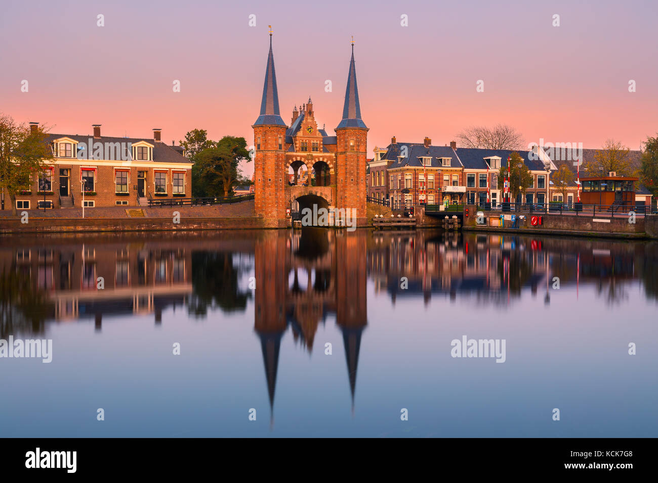 The Waterpoort or Hoogendster Pijp is a water gate, a gate in a defensive wall that connects a city to a waterway. It is situated in Sneek, the Nether Stock Photo