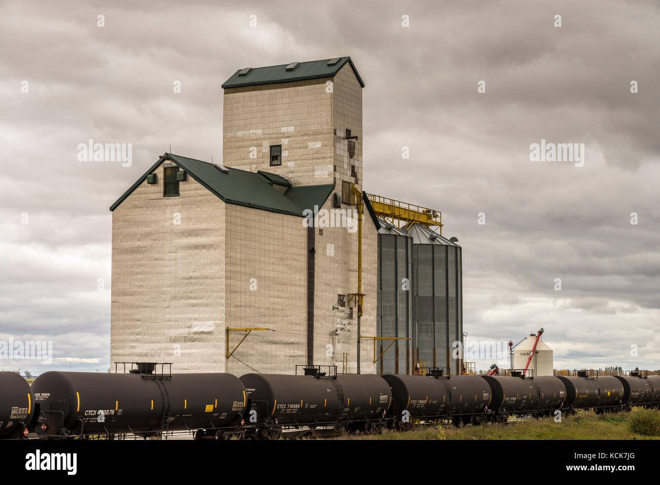 Freight train and grain elevator in Saskatchewan, Canada Stock Photo