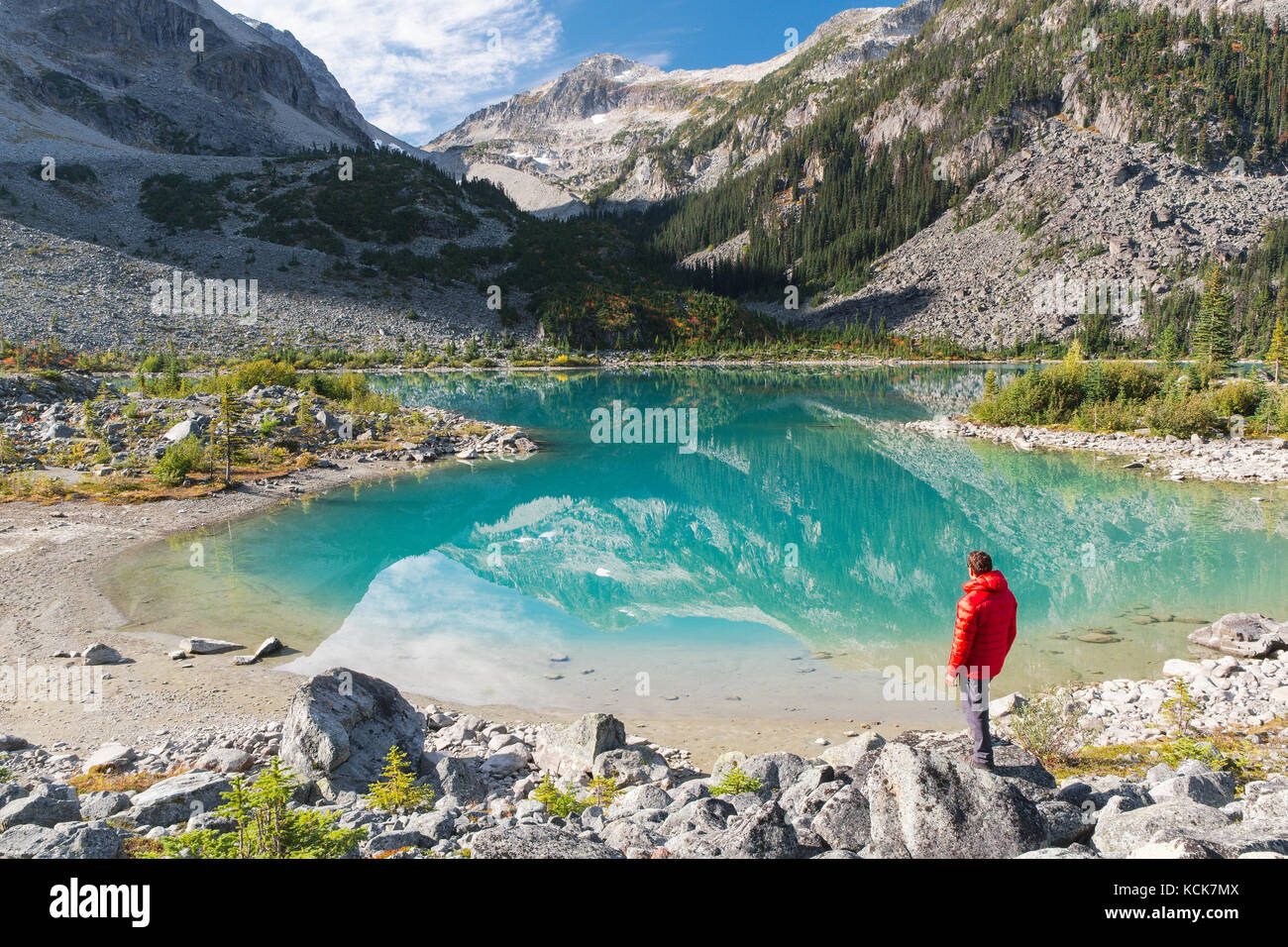 Hiker exploring the shore of upper Joffre Lake at Joffre Lakes provincial park in British Columbia, Canada. Stock Photo