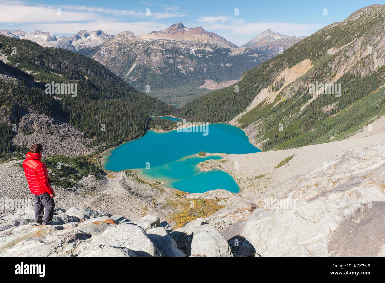 Hiker overlooking the three lakes at Joffre Lakes provincial park, British Columbia, Canada. Stock Photo