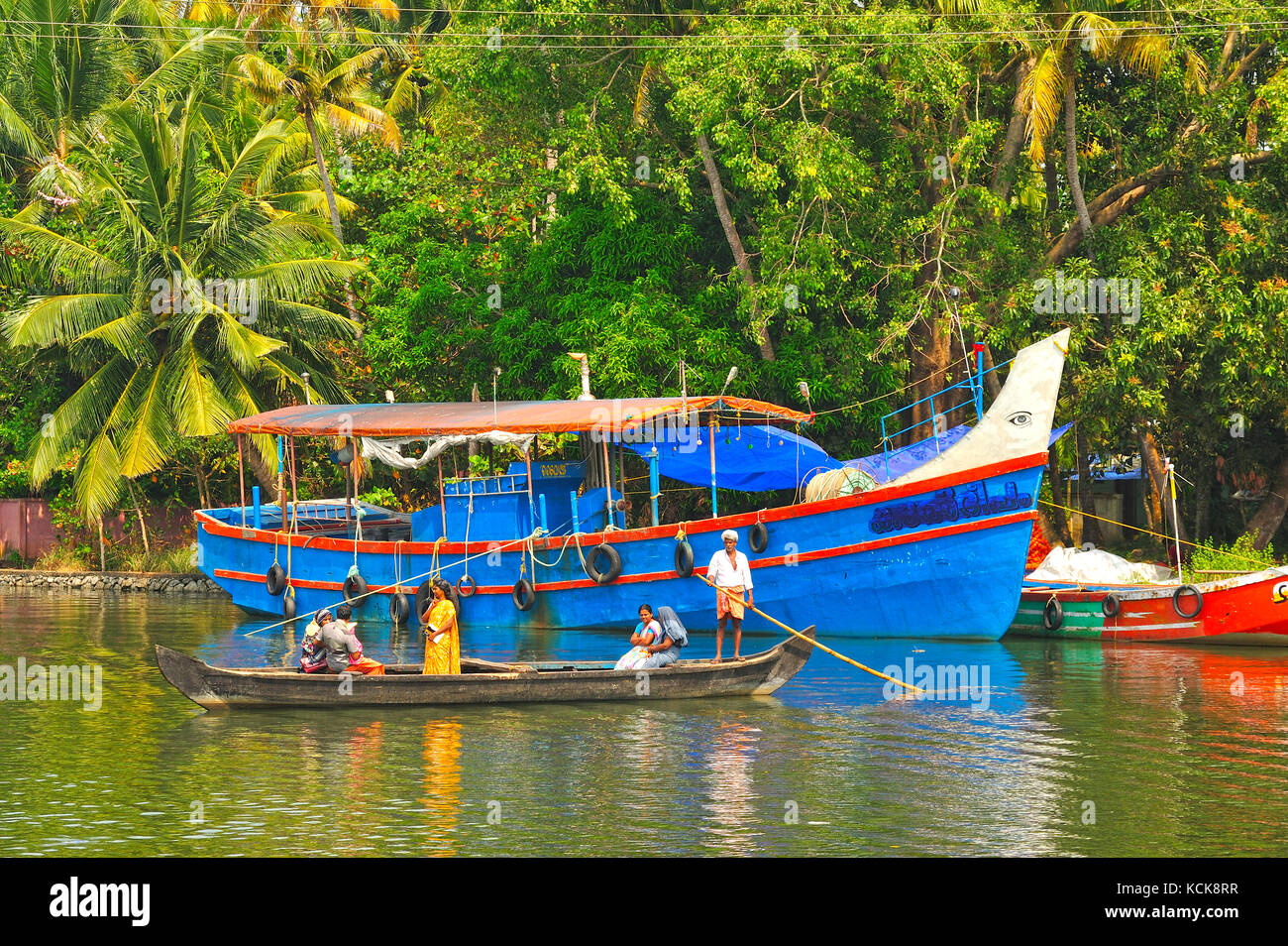 Canoe fishing boats in backwaters between kollam cochin hires stock