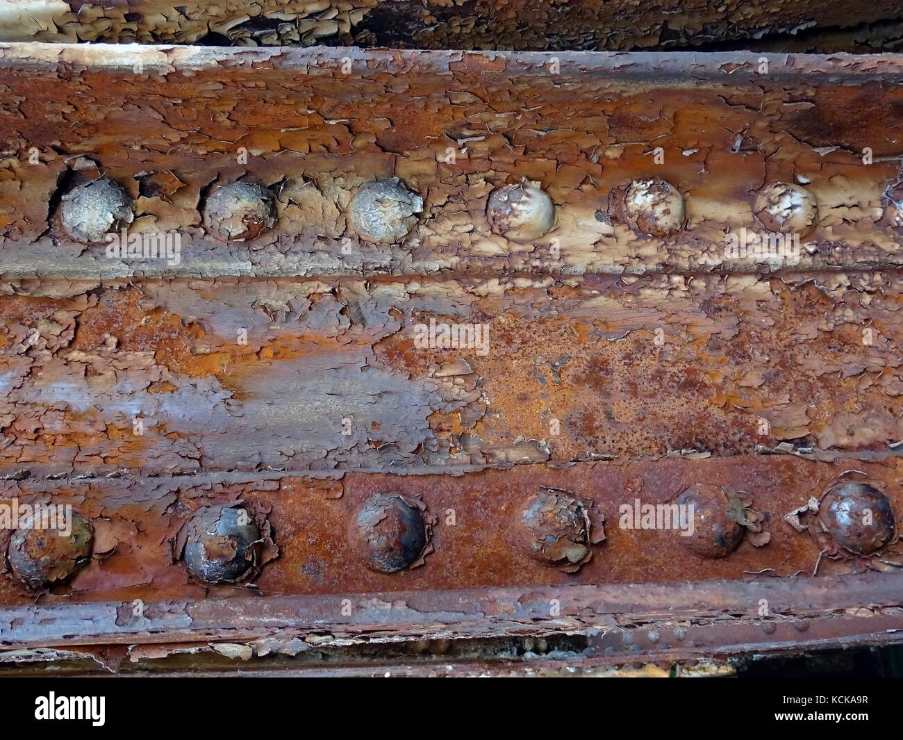 A close up of a rusty steel riveted girder Stock Photo