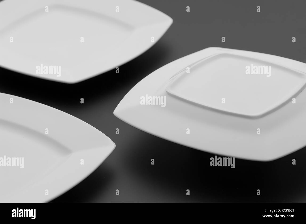 https://c8.alamy.com/comp/KCKBC3/kitchen-and-restaurant-utensils-plates-on-a-dark-background-KCKBC3.jpg