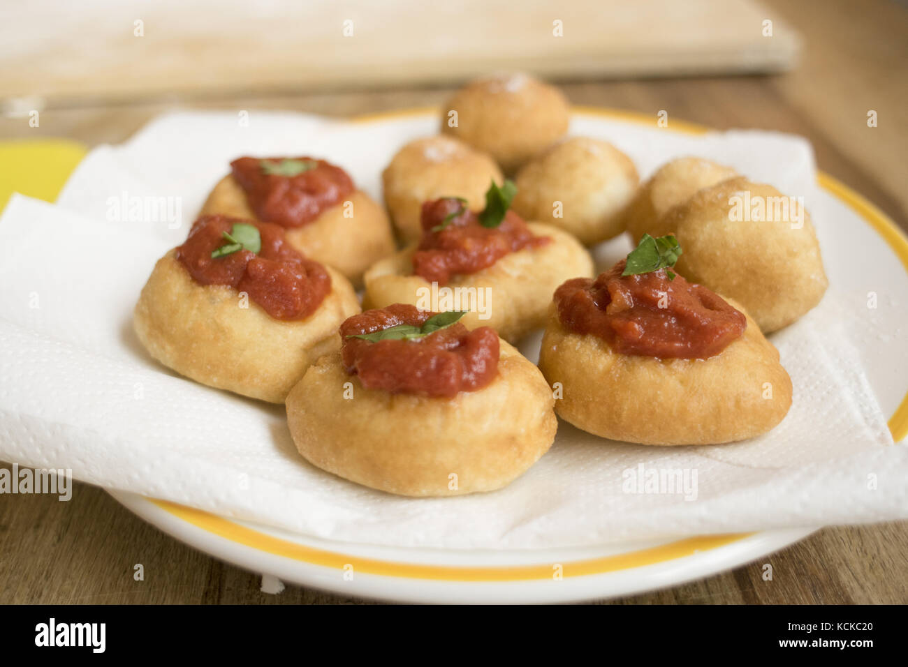 deepfried starters traditional of sicily called frittelle al pomodoro