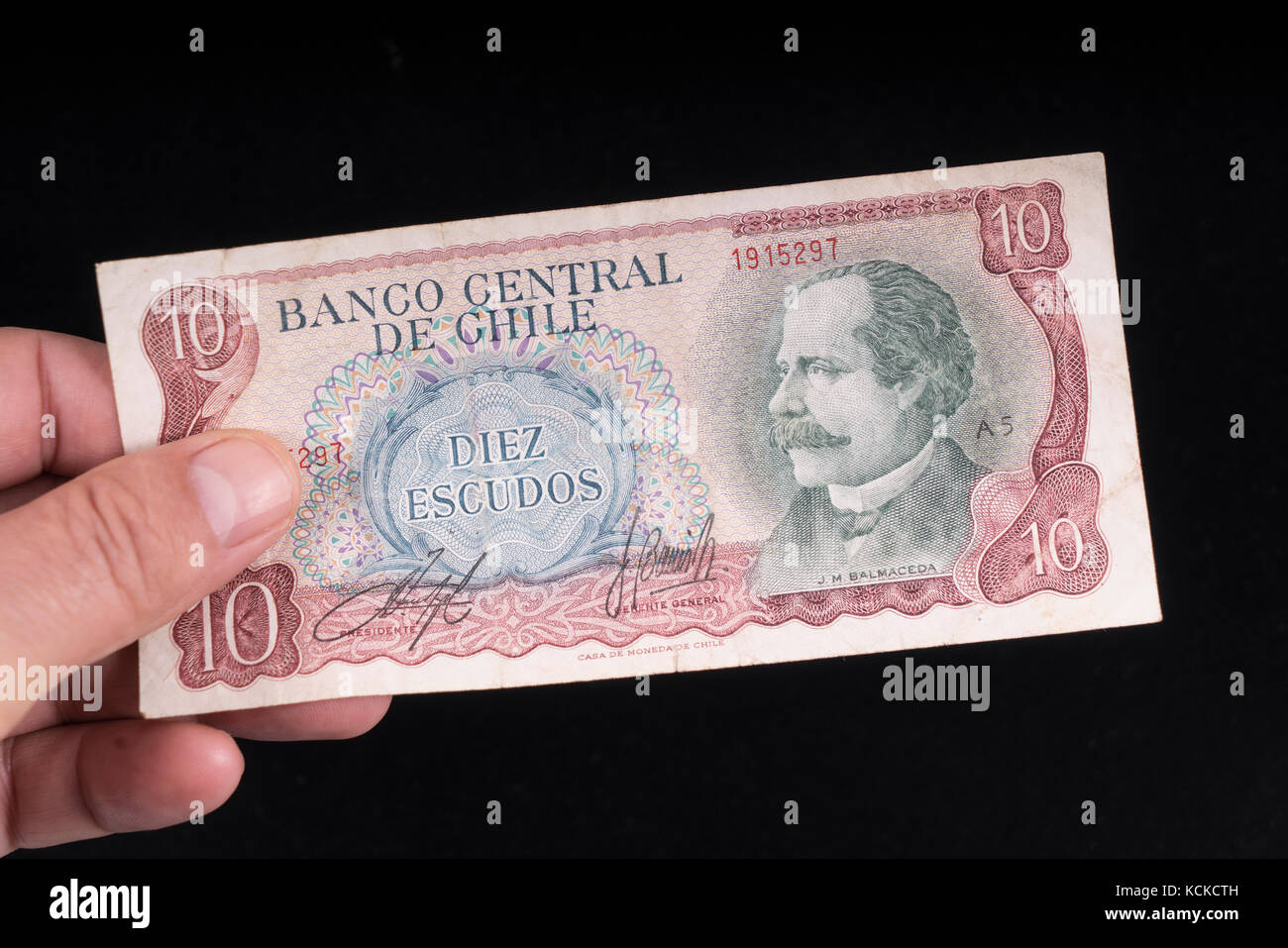 An old Chilean banknote on hand Stock Photo