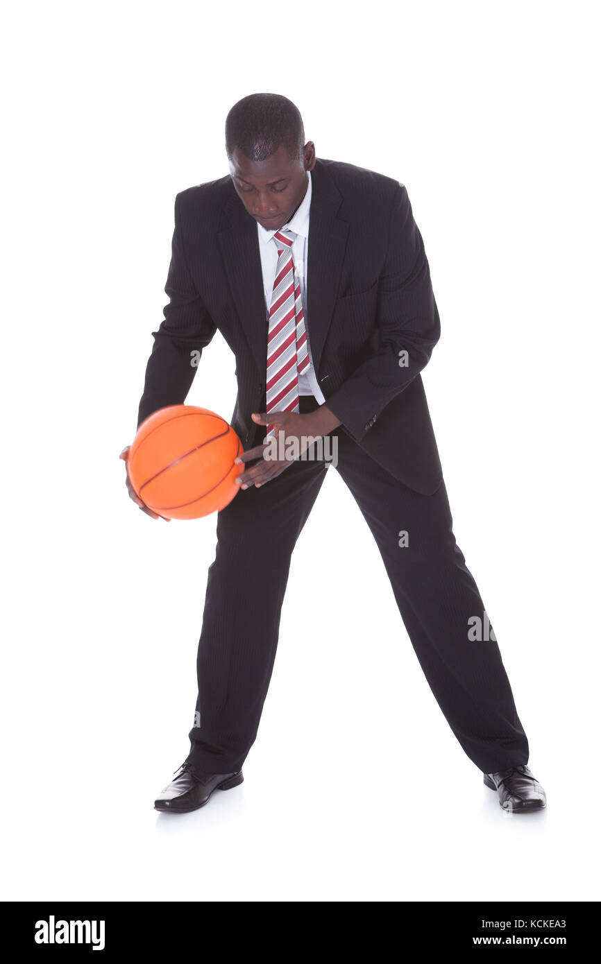 Portrait Of Young African Businessman Playing Basketball Stock Photo
