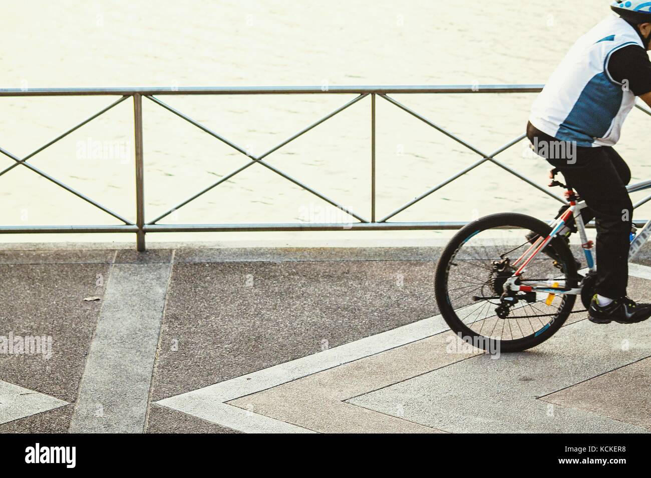 Unrecognizable person riding a bicycle Stock Photo